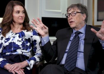 Microsoft co-founder Bill Gates speaks while his wife Melinda looks on during an interview in New York, U.S. on February 22, 2016. REUTERS/Shannon Stapleton/File Photo