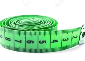 Green centimeter measuring tape on white background